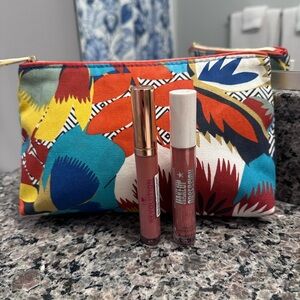 Revolution Lip Gloss set with  Estée Lauder makeup bag